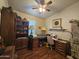 This craft room features a wooden desk, shelving, and cabinets for ample storage and functionality at 650 N Hawes Rd # 4123, Mesa, AZ 85207
