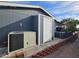 Home exterior features a storage area and an AC unit at 650 N Hawes Rd # 4123, Mesa, AZ 85207