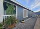 Well-maintained home exterior, showcasing lush greenery, charming details and ample natural light at 650 N Hawes Rd # 4123, Mesa, AZ 85207