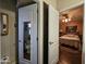 Hallway view of bathroom and bedroom with neutral wall colors at 650 N Hawes Rd # 4123, Mesa, AZ 85207