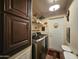Well-lit laundry room with modern appliances, cabinets, and storage at 650 N Hawes Rd # 4123, Mesa, AZ 85207