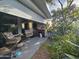 Comfortable patio area with cozy chairs and a decorative fireplace at 650 N Hawes Rd # 4123, Mesa, AZ 85207