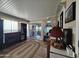 Bright sun room with tiled floors, fireplace, and access to the outdoor area at 650 N Hawes Rd # 4123, Mesa, AZ 85207