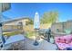 Fenced backyard with dining furniture, an umbrella and a grill at 6826 S 16Th Way, Phoenix, AZ 85042