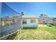 Backyard with grass, trampoline and backyard playset at 6826 S 16Th Way, Phoenix, AZ 85042