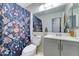 Well-lit bathroom featuring vanity, mirror, and floral shower curtain at 6826 S 16Th Way, Phoenix, AZ 85042