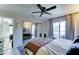 Bedroom featuring a ceiling fan and a sliding glass door leading to the outside at 6826 S 16Th Way, Phoenix, AZ 85042