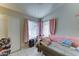 Comfortable bedroom with natural light and a cozy daybed at 6826 S 16Th Way, Phoenix, AZ 85042