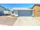 Charming single-story home with a gray and white exterior, a two-car garage, and a well-kept yard at 6826 S 16Th Way, Phoenix, AZ 85042