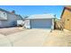 Charming single-story home with a gray and white exterior, a two-car garage, and a well-kept yard at 6826 S 16Th Way, Phoenix, AZ 85042