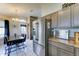 Kitchen and dining area featuring wooden cabinets, stainless steel appliances, and a sleek countertop at 6826 S 16Th Way, Phoenix, AZ 85042