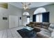 Bright living room with neutral tones, comfortable seating, and a ceiling fan at 6826 S 16Th Way, Phoenix, AZ 85042