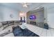 Bright living room boasts a decorative accent wall and tile floors at 6826 S 16Th Way, Phoenix, AZ 85042