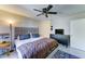 Comfortable main bedroom features a ceiling fan and modern decor at 6826 S 16Th Way, Phoenix, AZ 85042