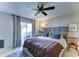 Relaxing main bedroom features a ceiling fan and sliding glass door at 6826 S 16Th Way, Phoenix, AZ 85042