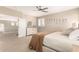 Cozy bedroom featuring soft lighting, neutral decor, plantation shutters and comfortable carpet at 6870 S Crestview Dr, Gilbert, AZ 85298