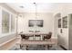 Dining room features a wood table, bench, and a modern light fixture at 6870 S Crestview Dr, Gilbert, AZ 85298