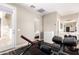 Brightly lit workout room with weights and exercise equipment, conveniently located near an ensuite bathroom at 6870 S Crestview Dr, Gilbert, AZ 85298