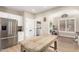 Kitchen with stainless steel appliances, a breakfast bar, and a refrigerator at 6870 S Crestview Dr, Gilbert, AZ 85298