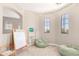 Inviting playroom with easel, bookcase, beanbag chairs, and charming string lights, perfect for creative play at 6870 S Crestview Dr, Gilbert, AZ 85298