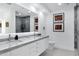 Modern bathroom features double sinks, marble countertop, sleek fixtures, and decorative wall art at 7137 E Rancho Vista Dr # 6011, Scottsdale, AZ 85251