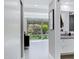 Bright bathroom with natural light, white cabinets, modern fixtures, and an open doorway to a bedroom at 7137 E Rancho Vista Dr # 6011, Scottsdale, AZ 85251