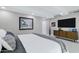 Inviting bedroom features a plush king bed, modern furniture, and large flat-screen TV at 7137 E Rancho Vista Dr # 6011, Scottsdale, AZ 85251