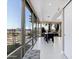 Bright dining room with floor to ceiling windows and a modern dining table set at 7137 E Rancho Vista Dr # 6011, Scottsdale, AZ 85251