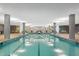 Bright indoor swimming pool with modern design, ample lighting, and sleek architectural details at 7137 E Rancho Vista Dr # 6011, Scottsdale, AZ 85251