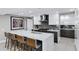 Modern kitchen featuring a large island with bar seating and stainless steel appliances at 7137 E Rancho Vista Dr # 6011, Scottsdale, AZ 85251