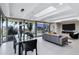 Open concept living and dining room with floor-to-ceiling windows and fireplace at 7137 E Rancho Vista Dr # 6011, Scottsdale, AZ 85251
