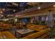 Comfortable outdoor patio featuring cozy seating, tables, strung lights and the building's exterior at 7137 E Rancho Vista Dr # 6011, Scottsdale, AZ 85251