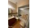 Bathroom featuring a vanity, toilet, shower-tub combination, and decorative mirror at 7139 E Arcadia Cir, Mesa, AZ 85208