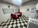 Unique dining area with retro diner style booth, black and white tile floors, and classic decor at 7139 E Arcadia Cir, Mesa, AZ 85208