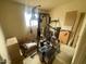 Exercise room featuring exercise equipment, neutral walls, and a window for natural light at 7139 E Arcadia Cir, Mesa, AZ 85208