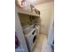 Functional laundry area with a Samsung washing machine and additional storage space above at 7139 E Arcadia Cir, Mesa, AZ 85208