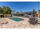 Spacious backyard featuring a refreshing in-ground swimming pool and inviting lounge chairs at 7727 E 4Th St, Scottsdale, AZ 85251