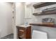 Modern bathroom featuring floating shelves, contemporary fixtures, and walk in shower at 7727 E 4Th St, Scottsdale, AZ 85251