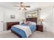 Cozy bedroom featuring a comfortable bed, ceiling fan, and natural light at 7727 E 4Th St, Scottsdale, AZ 85251