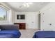 Comfortable bedroom with carpet flooring, light gray walls, and large closet at 7727 E 4Th St, Scottsdale, AZ 85251
