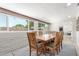 Spacious dining room with ample natural light and a large table at 7727 E 4Th St, Scottsdale, AZ 85251