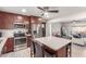 Modern kitchen with stainless steel appliances, central island, and stylish cabinetry, ideal for cooking at 7727 E 4Th St, Scottsdale, AZ 85251