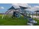 Community playground featuring a blue climbing structure with slides, stairs and covered seating at 7837 E Raleigh Ave, Mesa, AZ 85212