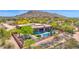 Expansive desert home with a sparkling pool and desert landscaping in a stunning hillside setting at 8300 E Lone Mountain Rd, Scottsdale, AZ 85266