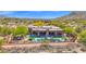Expansive single-story home boasts a sparkling pool and desert landscaping at 8300 E Lone Mountain Rd, Scottsdale, AZ 85266