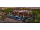 Desert home showcasing a beautiful backyard pool with landscaping, patio, and mountain views at 8300 E Lone Mountain Rd, Scottsdale, AZ 85266