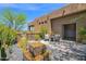 This backyard boasts desert landscaping, a beautiful water feature and comfortable outdoor seating for relaxing and enjoying the outdoors at 8300 E Lone Mountain Rd, Scottsdale, AZ 85266