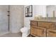 Elegant bathroom featuring stone tile, a glass-enclosed shower, granite countertop, and horse-themed decor at 8300 E Lone Mountain Rd, Scottsdale, AZ 85266