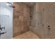 Modern walk-in shower with a built-in seat and multiple shower heads at 8300 E Lone Mountain Rd, Scottsdale, AZ 85266