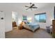 Inviting bedroom with a queen bed, soft lighting, a private bathroom, and a scenic outdoor view at 8300 E Lone Mountain Rd, Scottsdale, AZ 85266